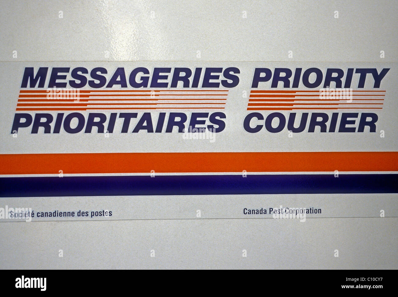 postal service, messageries prioritaires, priority courier, bilingual sign, city of Montreal, Montreal, Quebec Province, Canada, North America Stock Photo