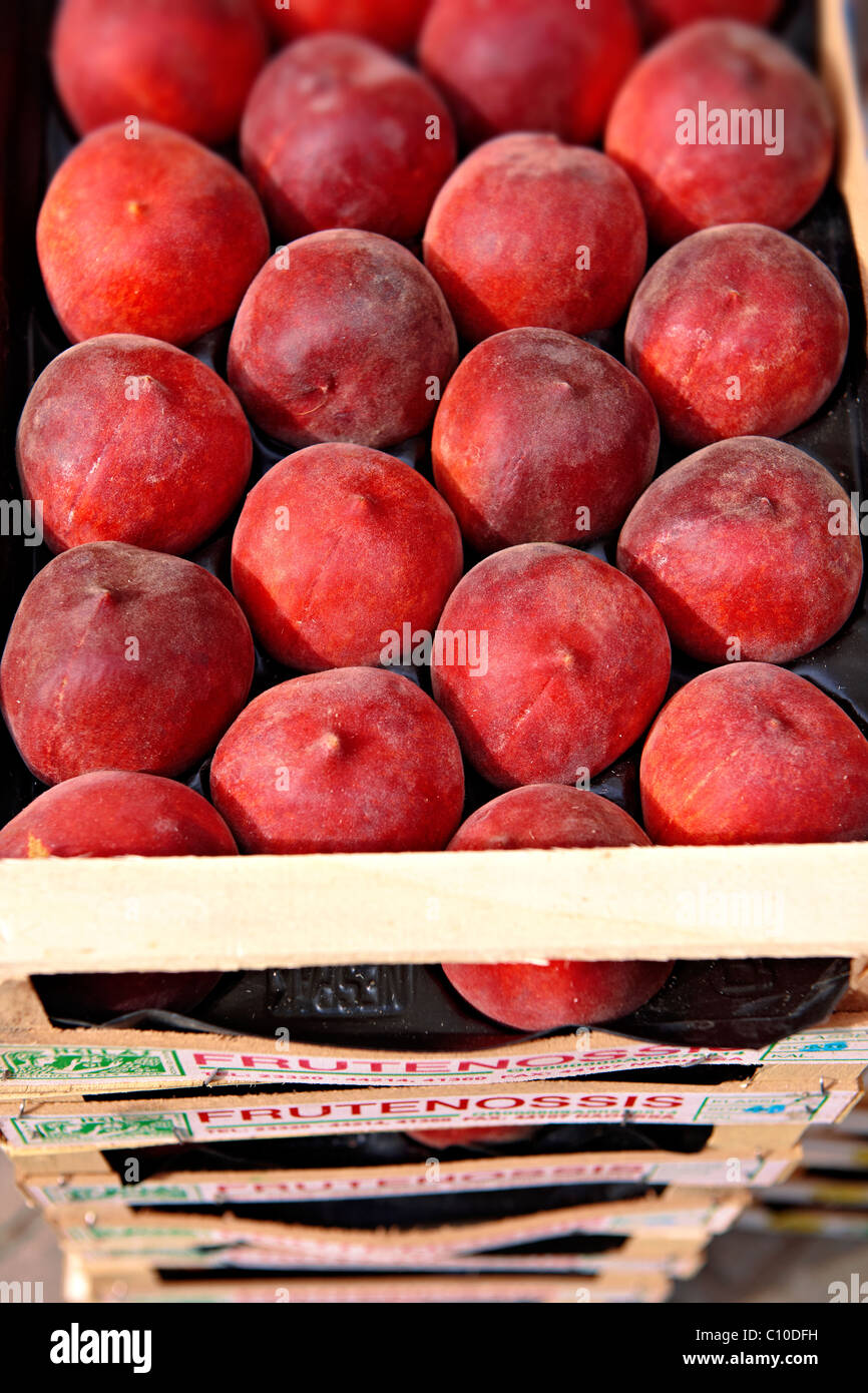 Fresh boxes of peaches outside a fruit shop, Corfu, Greek Ionian Islands Stock Photo