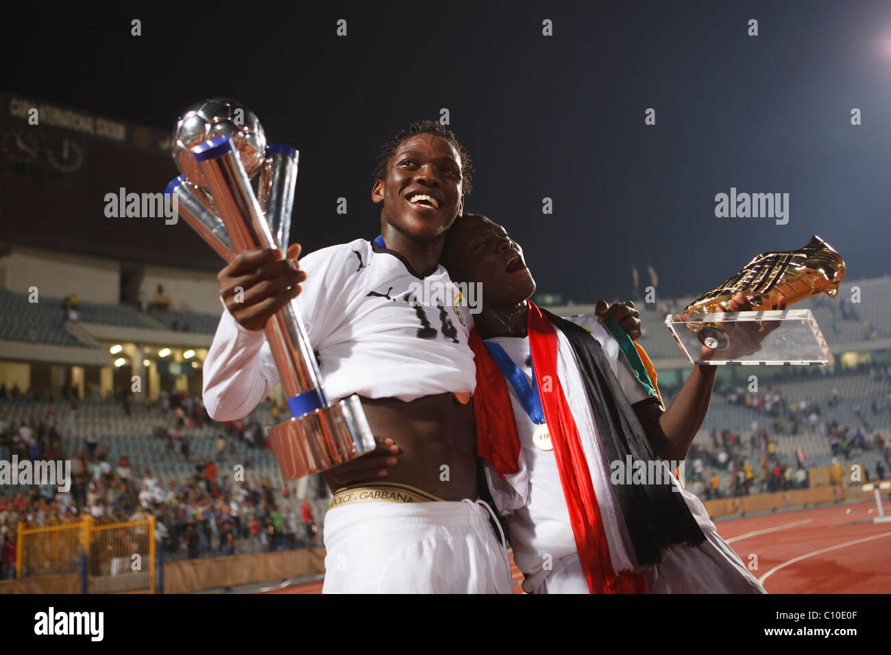 Ghana players Daniel Opare (l) and Dominic Adiyiah (r) celebrate after defeating Brazil to win the 2009 FIFA U-20 World Cup. Stock Photo