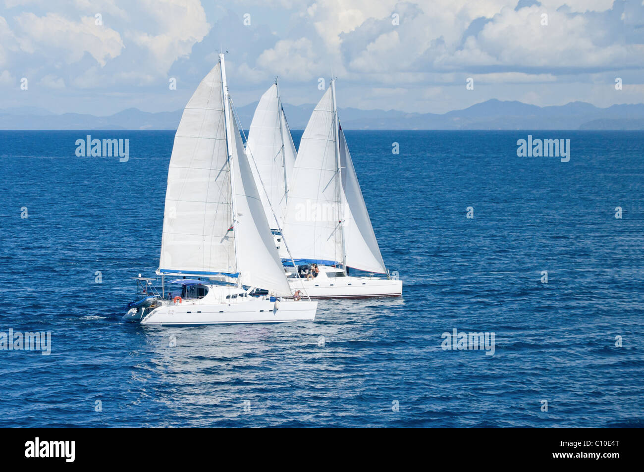 Three sailboats racing in the Indian Ocean Stock Photo