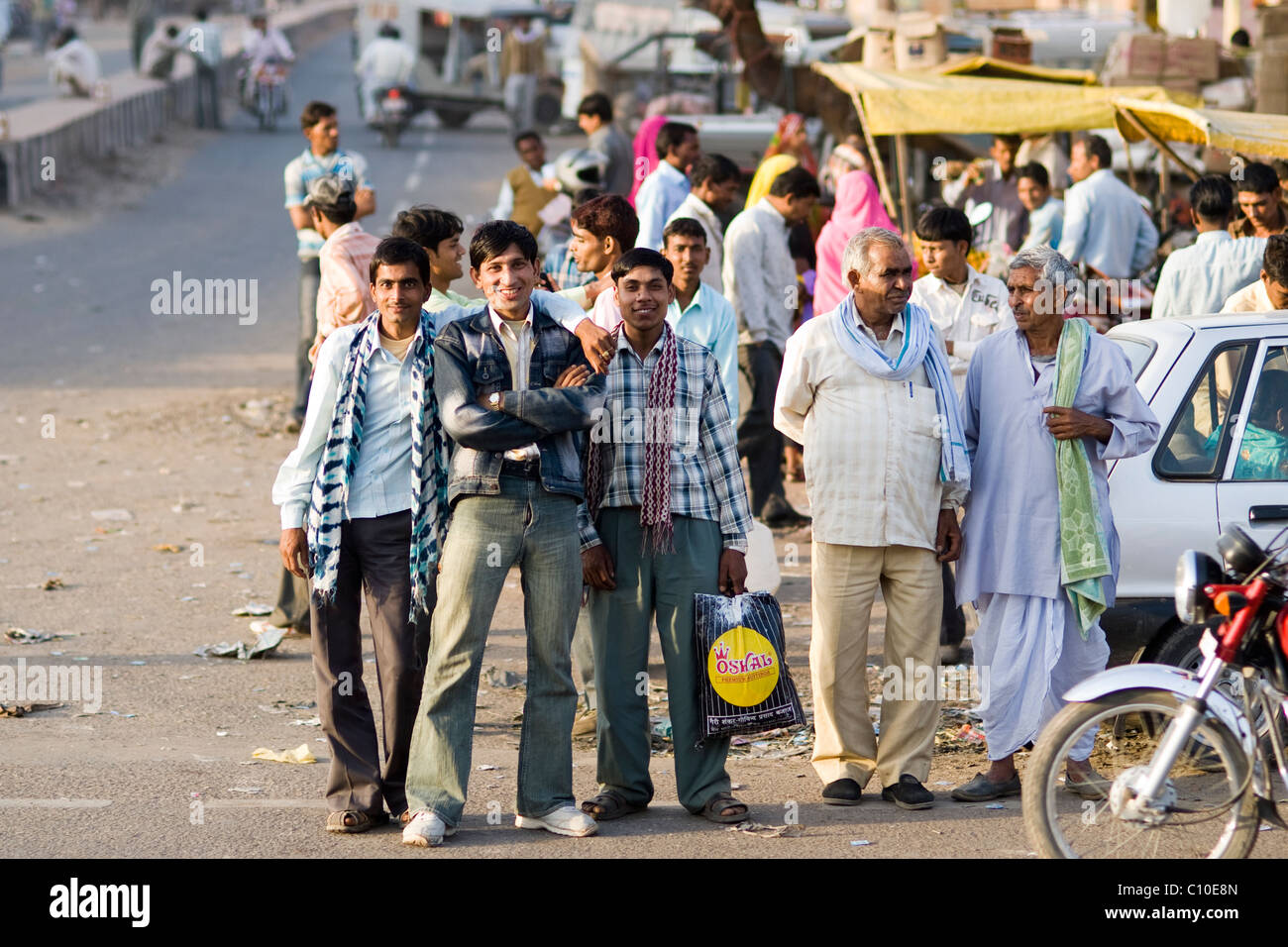 Street scene on a way into Agra, young Indian man looking into camera, India Stock Photo