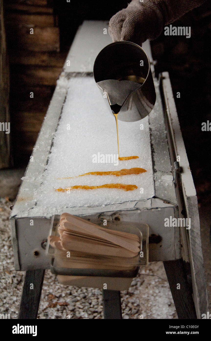 Canada, Quebec, Saint-Augustin-de-Desmaures. Le Chemin du Roy (aka Sugar Shack). Maple 'snow taffy'. Maple syrup. Stock Photo