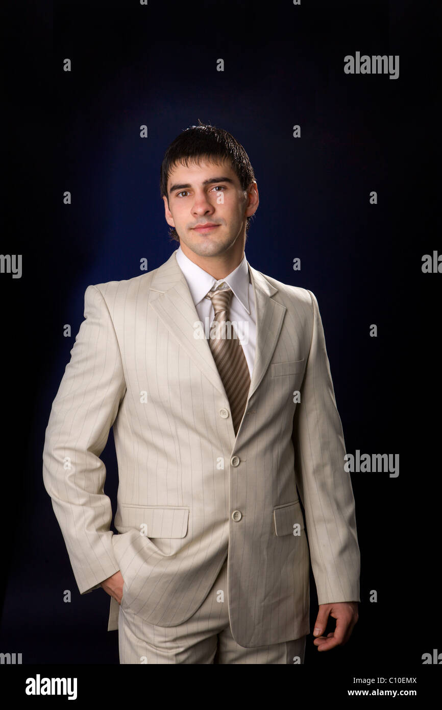 Young business man wearing suit with tie Stock Photo - Alamy