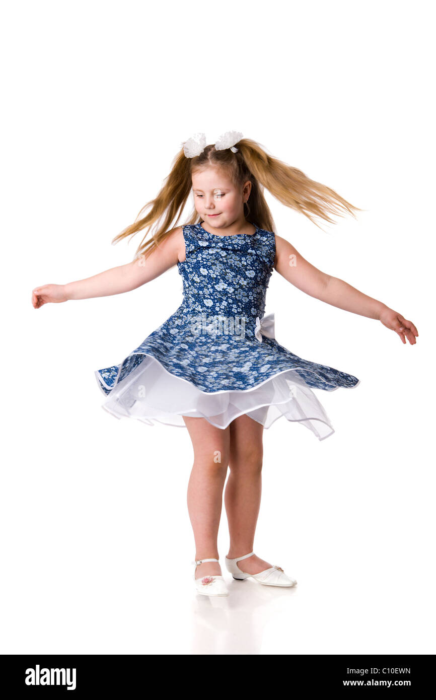 Cheerful girl spinning on floor isolated on white Stock Photo