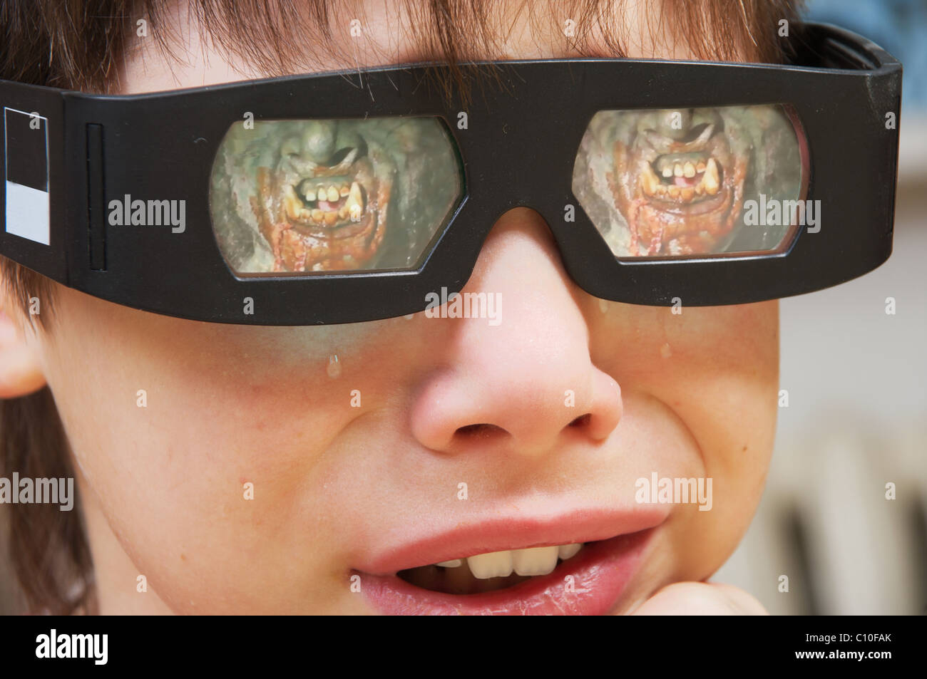 Young adult watching a 3d movie at home and cry Stock Photo