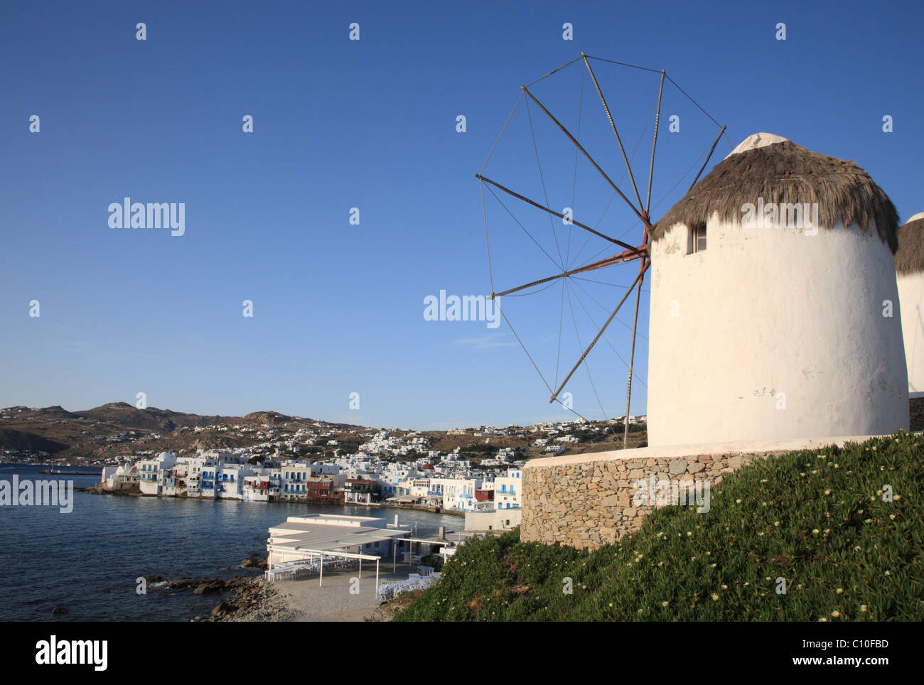Windmill, Little Venice in the background, Mykonos Town (Chora), Mykonos, Cyclades, Greece Stock Photo