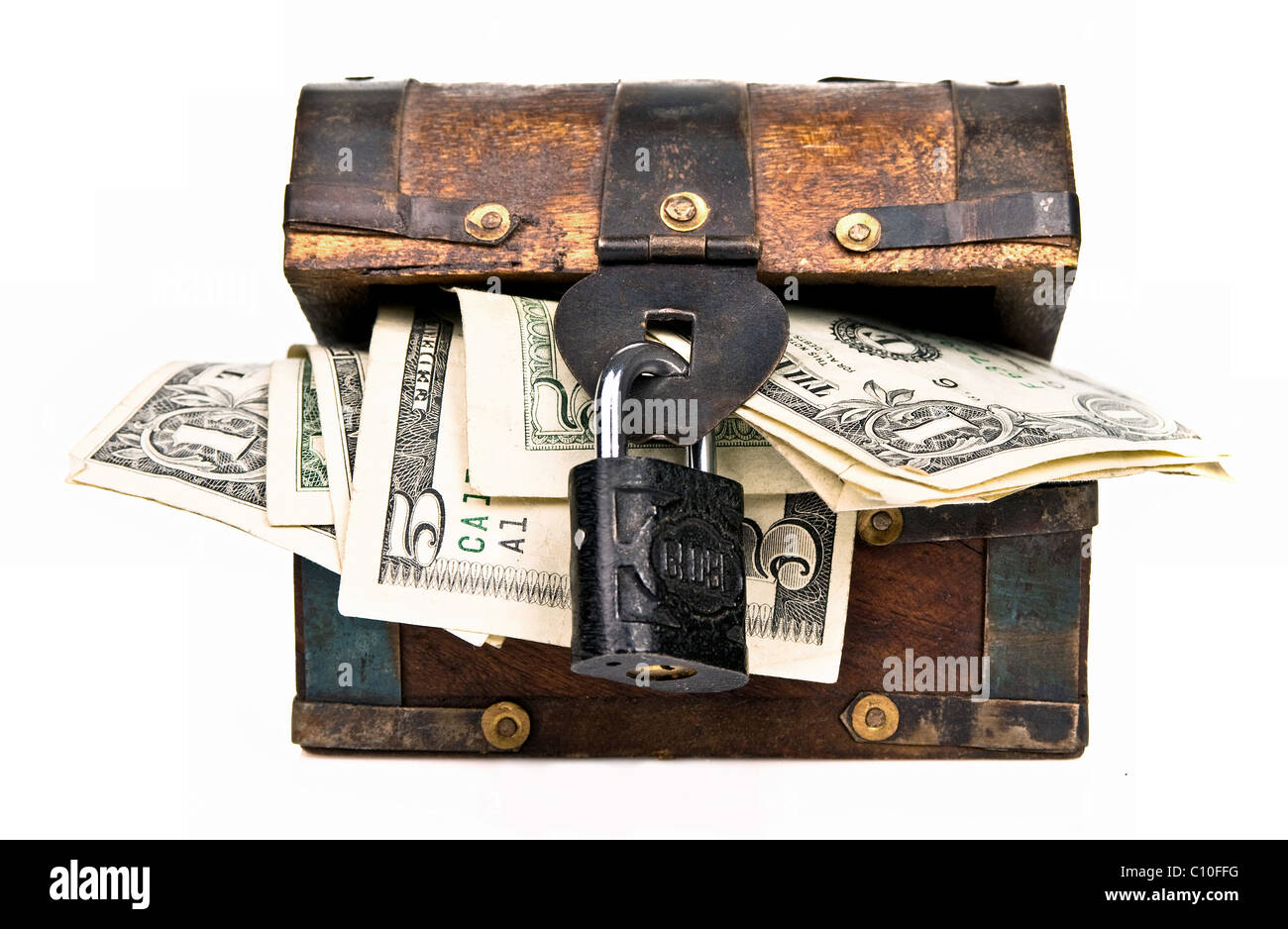 Padlocked small wooden chest with dollar bills Stock Photo