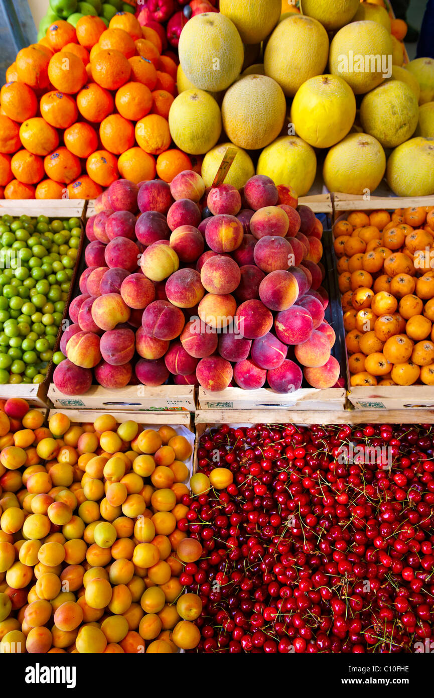 Fresh peaches, apricots & cherries on a fruit market stall, Syros, Greece Stock Photo
