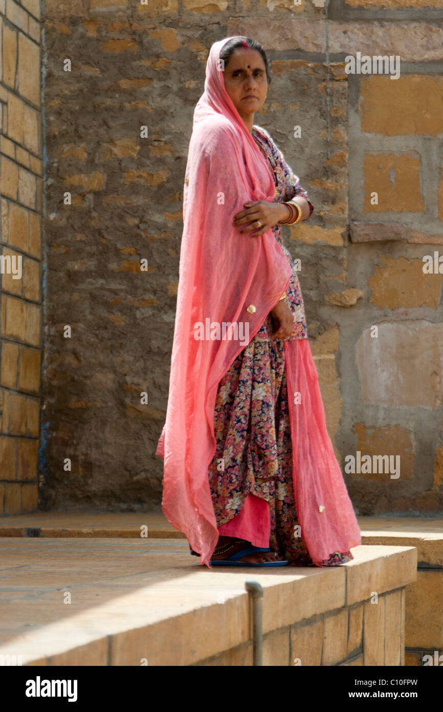 Portrait of an Indian woman in pink sari in the morning sun Stock Photo ...