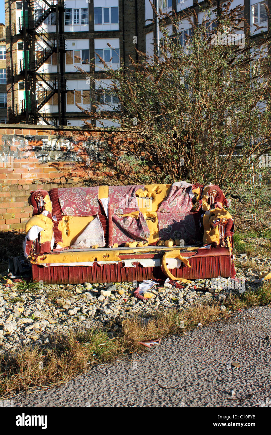 Urban Fly Tipping a Sofa or Couch urban decay inner city Stock Photo