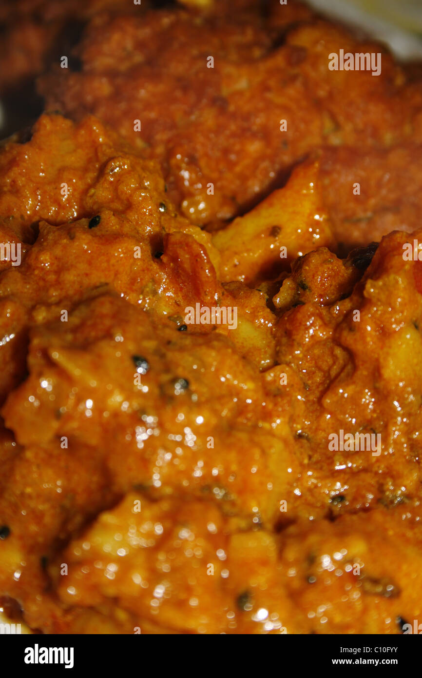 image of onion bhajis and bombay potatoes on white plate Stock Photo