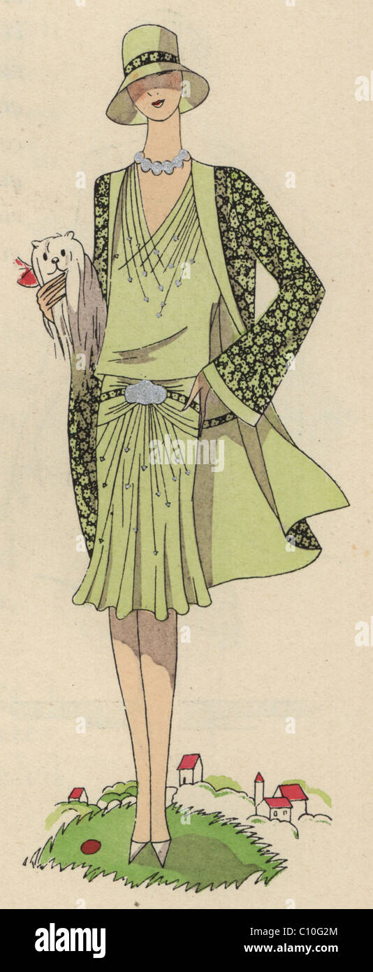 Fashionable woman in pale green afternoon ensemble in printed crepe de chine. Stock Photo