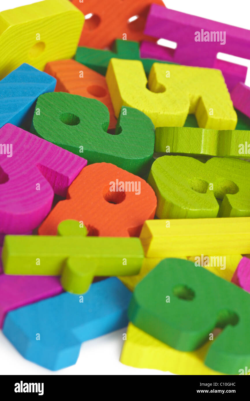 Pile of child toy wooden color letters Stock Photo