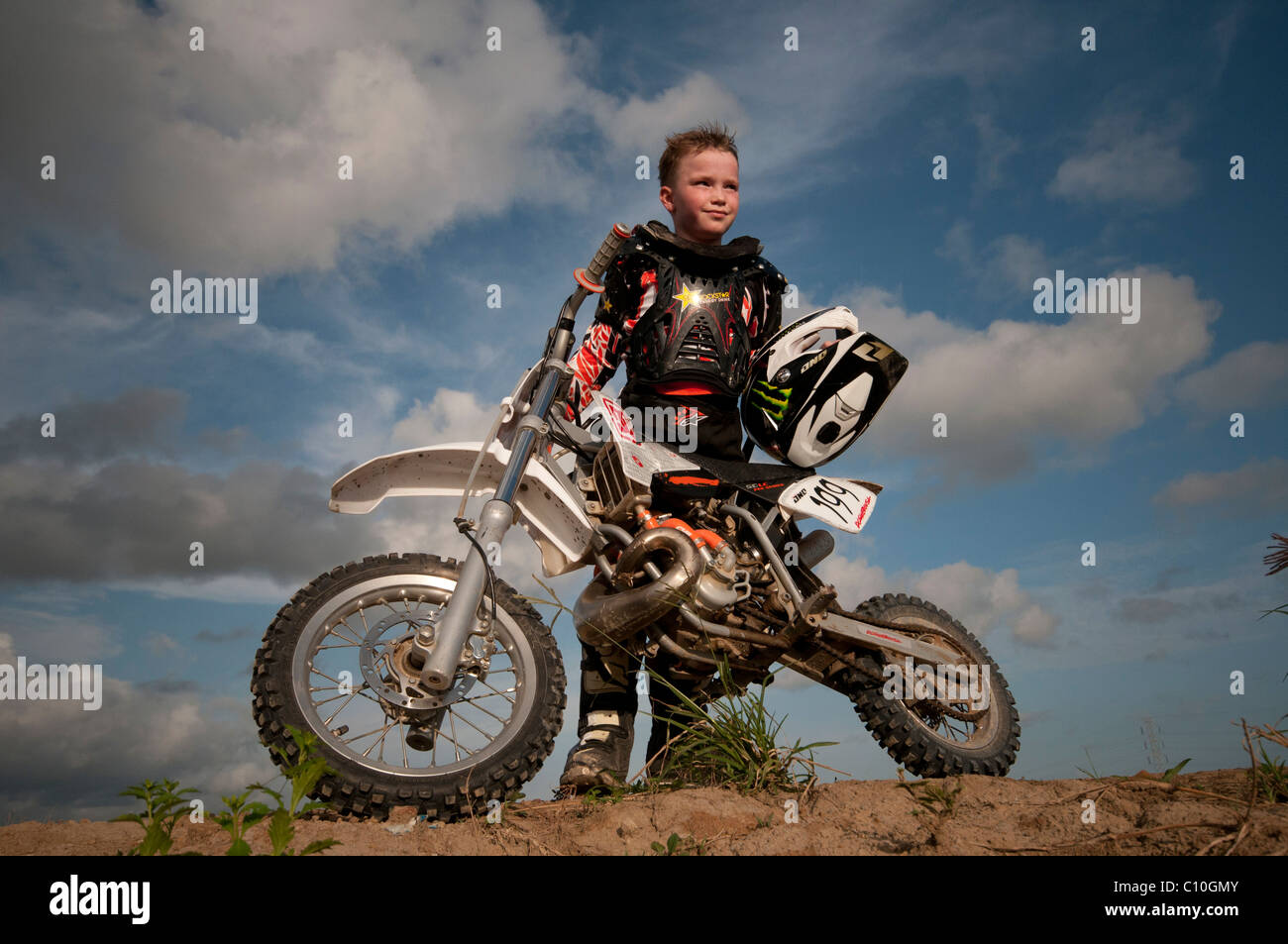A six year old boy with his motocross bike Stock Photo