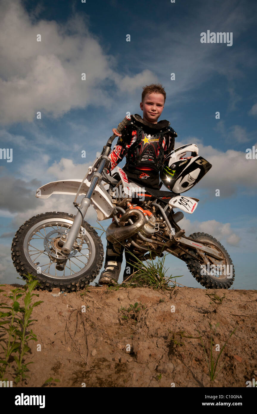 A six year old boy with his motocross bike Stock Photo