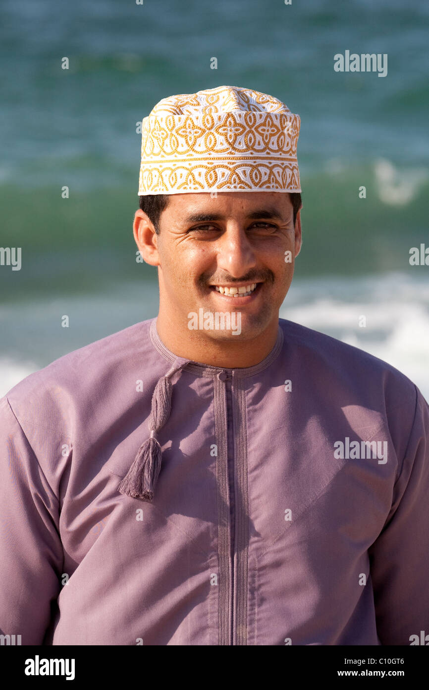 Young Arab Omani Man Smiling by the Sea Stock Photo