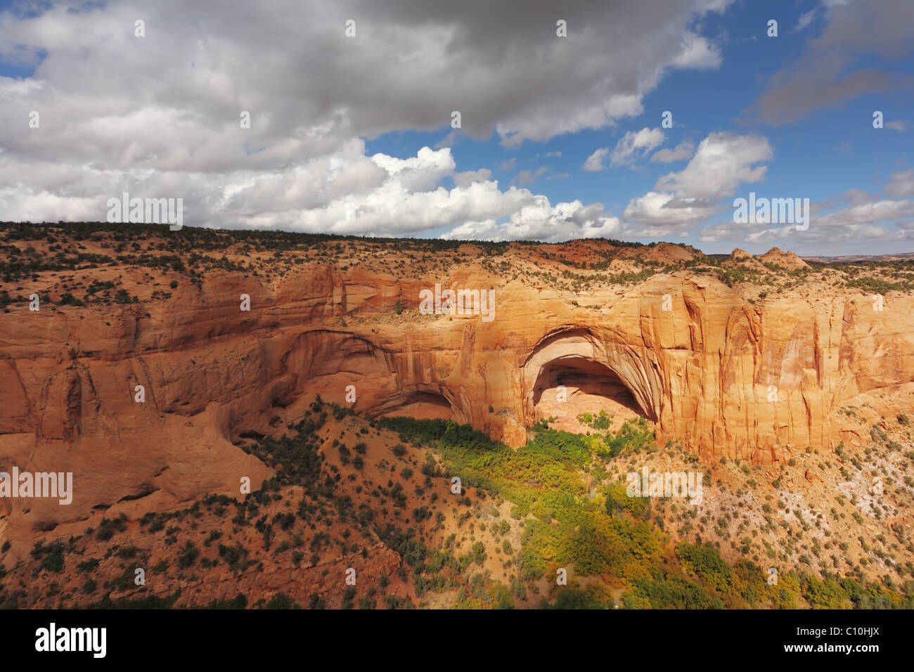 Prehistoric cave in a giant canyon of red sandstone Stock Photo