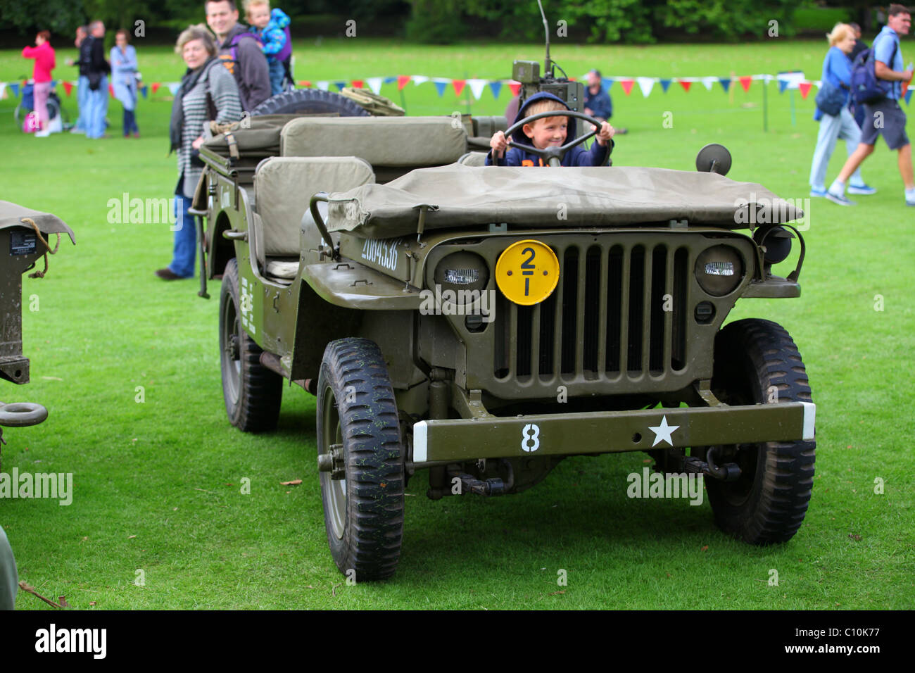 Reconstruction WW2 US Army Jeep with under-age driver Stock Photo