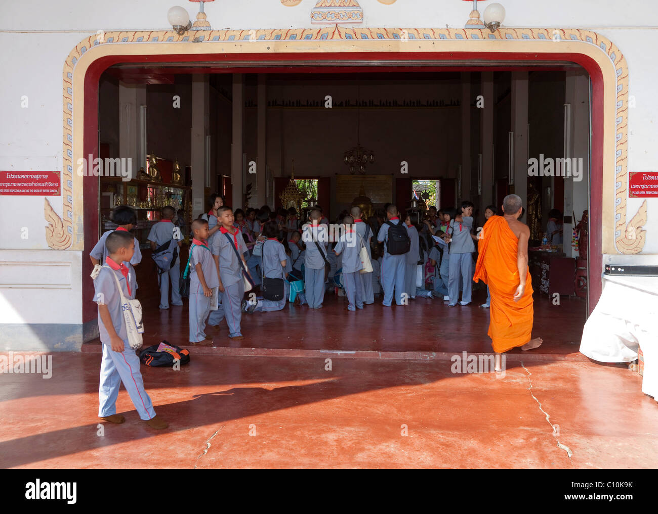 A school class visiting the Buddhist Wat Phra Thong Temple, Thalang, Phuket Island, Southern Thailand, Thailand, Southeast Asia Stock Photo