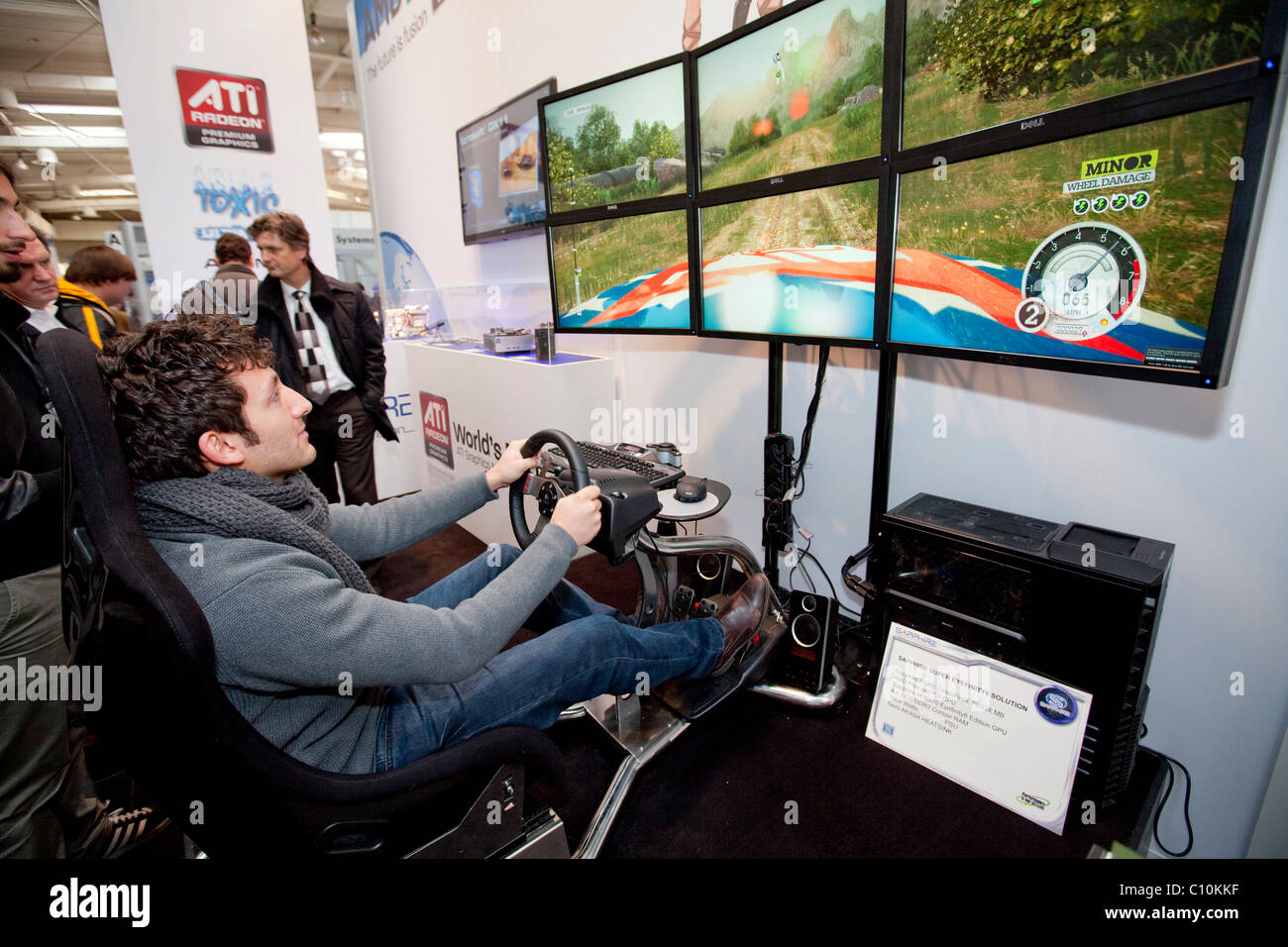 Visitors driving a race car in a video game, Internationale Computermesse CEBIT international computer fair, Hannover Stock Photo