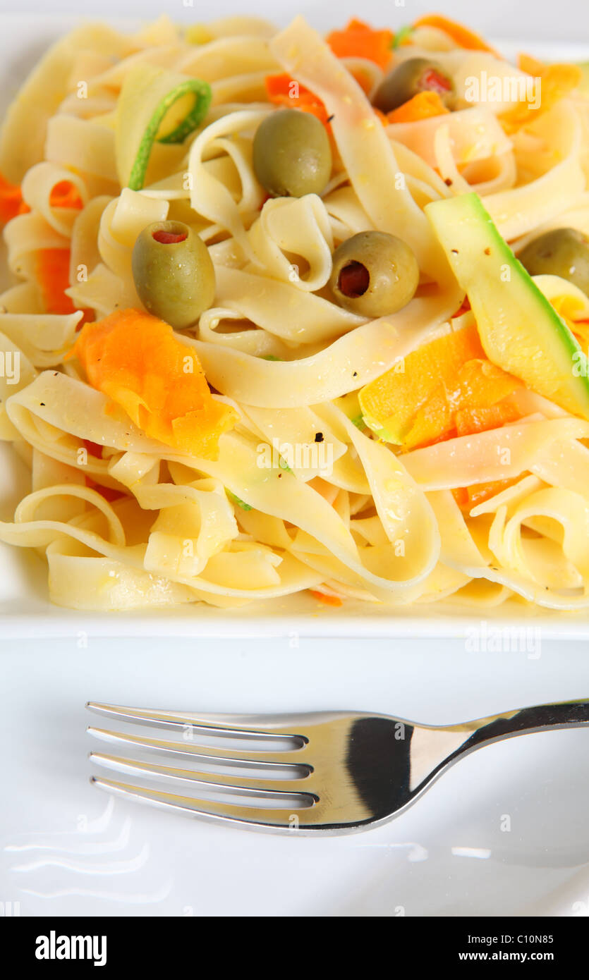 Tagliatelle with ribbons of carrot and courgette, stuffed olives and
