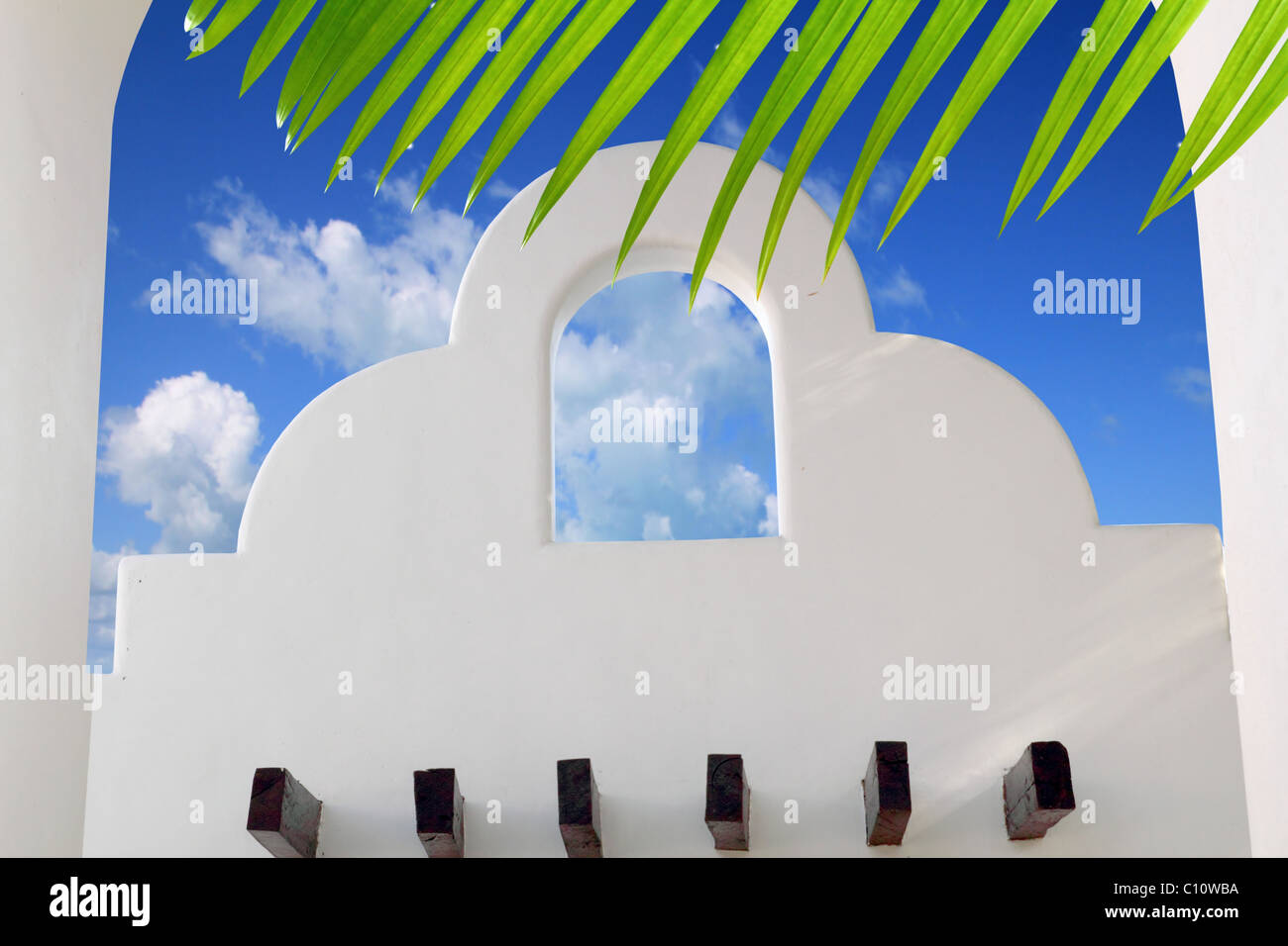 Mexican architecture white arch blue sky in Mayan Riviera Stock Photo