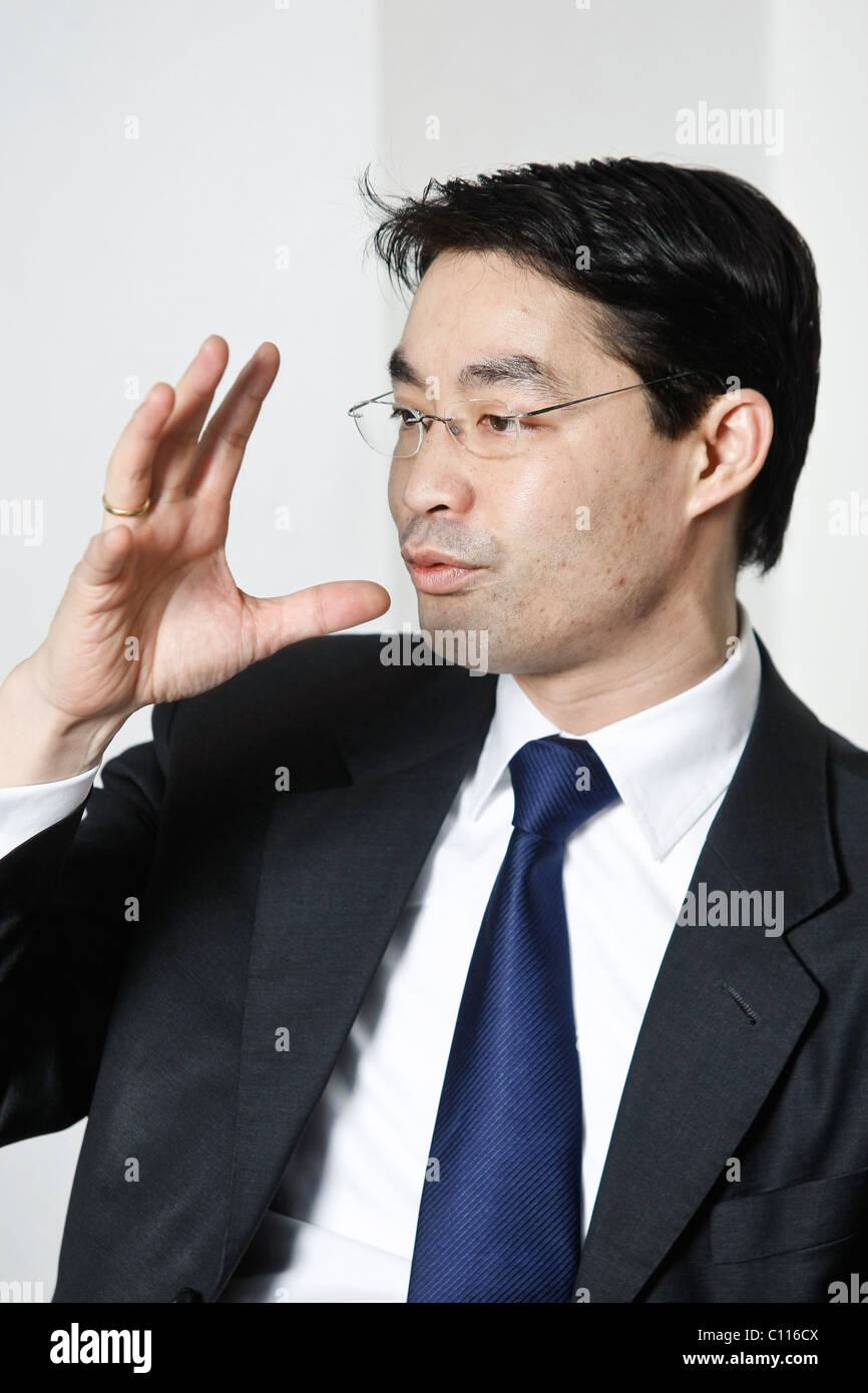 German health minister Philipp Roesler gestures during an interview. Stock Photo