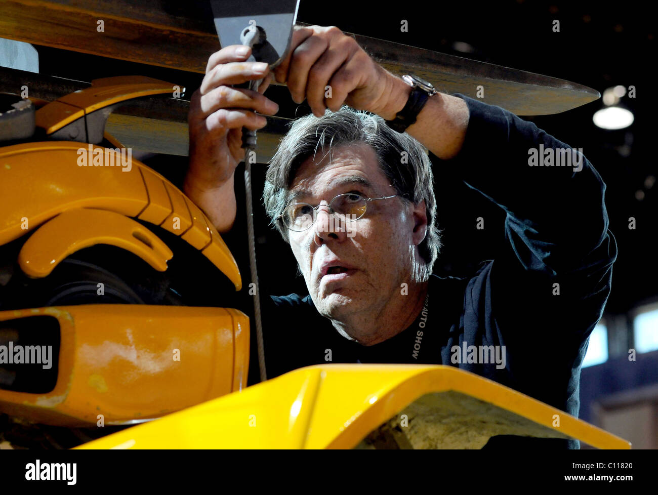 TRANSFORMER TOWERS OVER CAR SHOW This replica of a Transformers Autobot