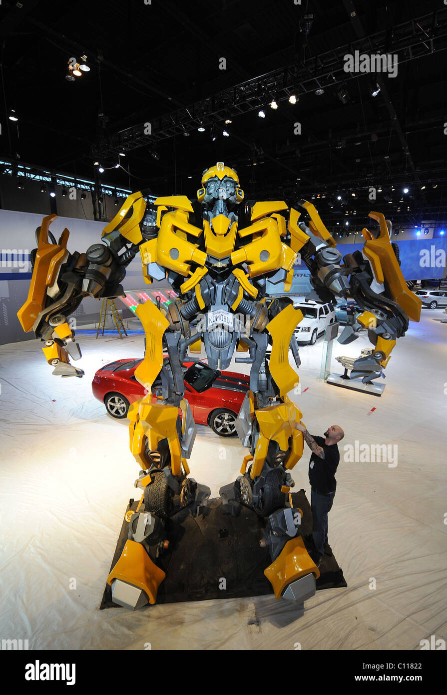 TRANSFORMER TOWERS OVER CAR SHOW This replica of a Transformers Autobot