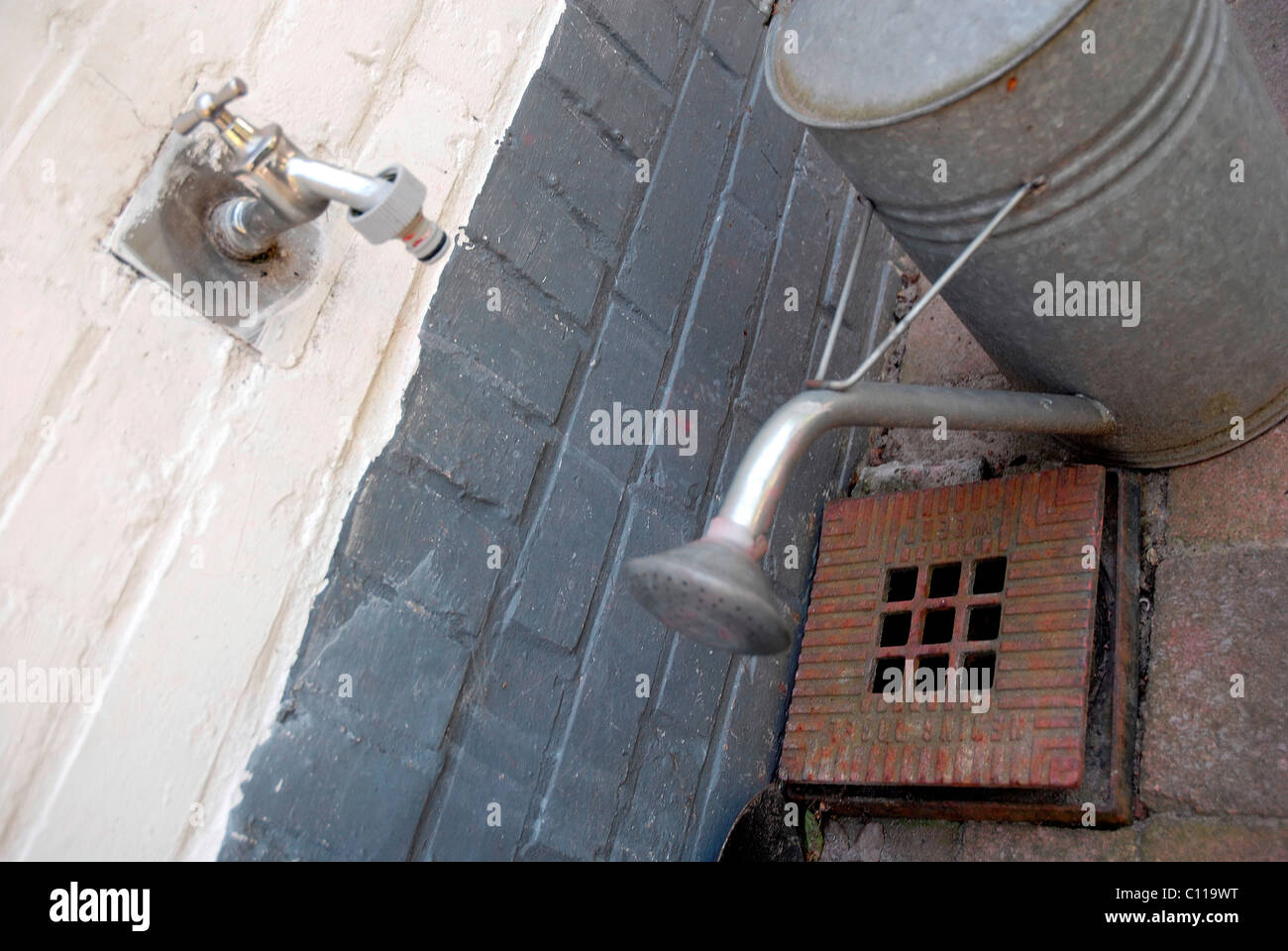 Garden water tap and watering can Stock Photo Alamy
