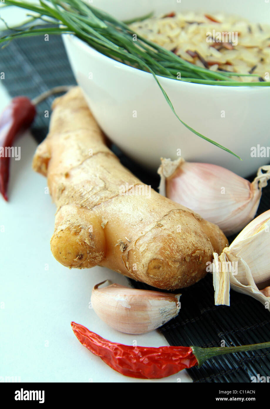 traditional asian ingredients uncooked rice, ginger, garlic, soy sause
