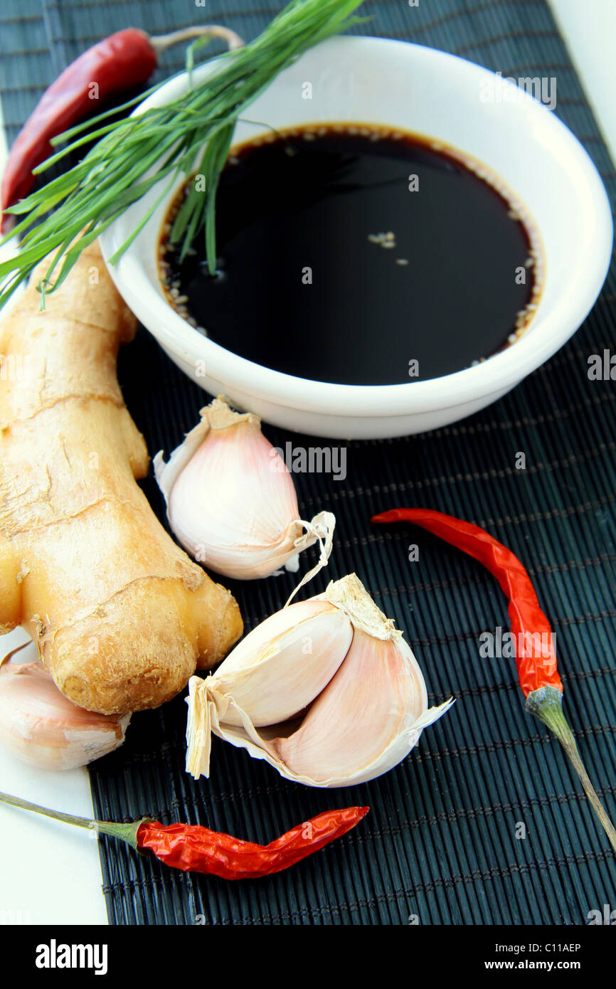 traditional asian ingredients uncooked rice, ginger, garlic, soy sause