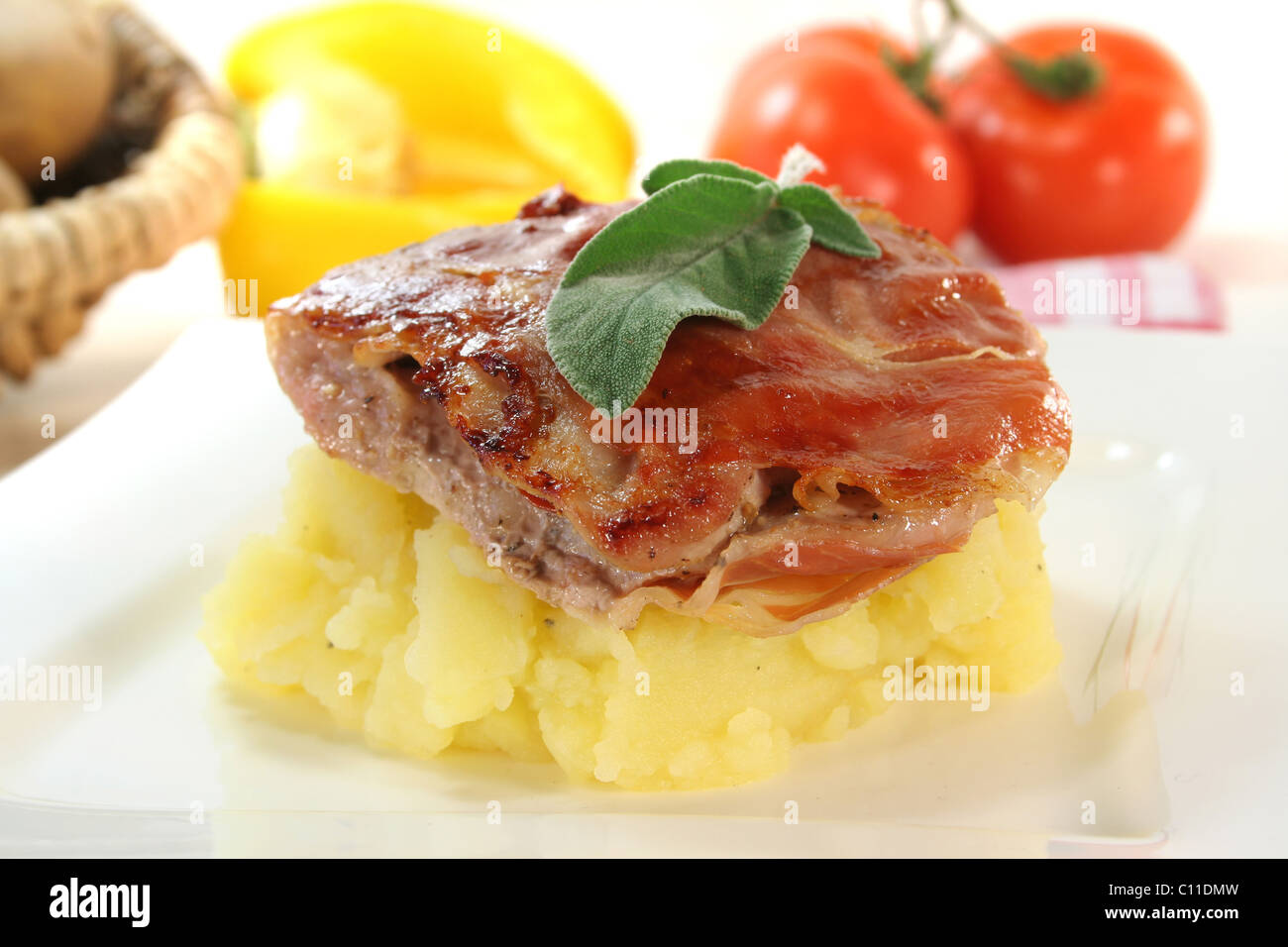 Saltimbocca of veal with bacon, sage and dried tomatoes Stock Photo Alamy