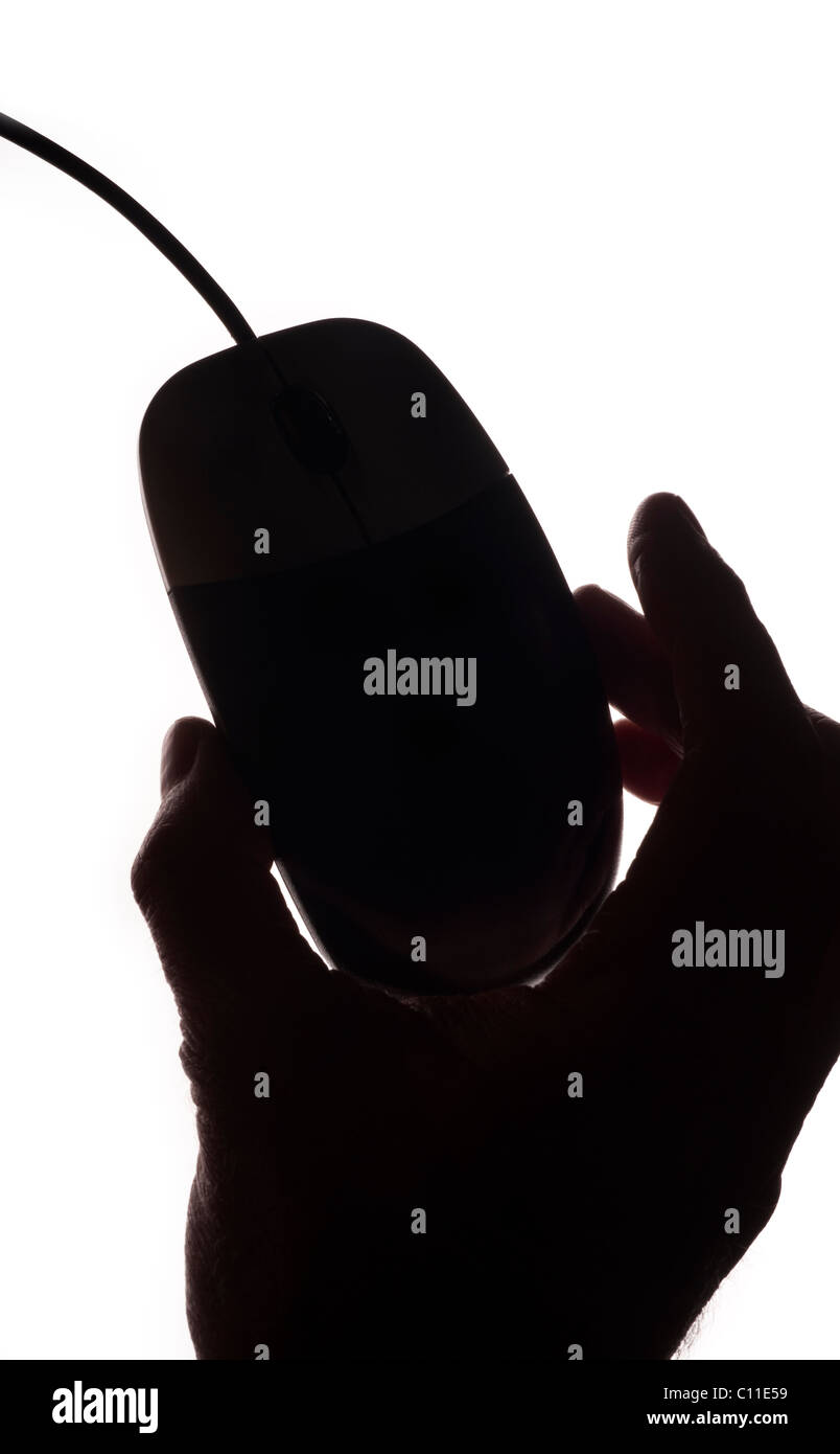 Hand holding a computer mouse on a white background Stock Photo - Alamy