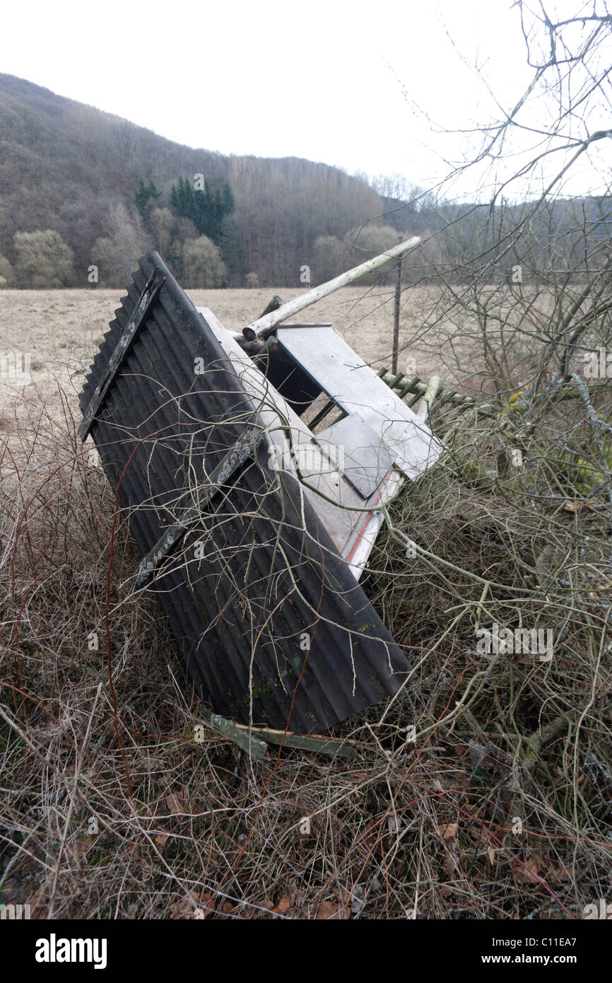 An overturned raised hide after the passage of the storm Xynthia in the Nettetal valley near , Rhineland-Palatinate Stock Photo