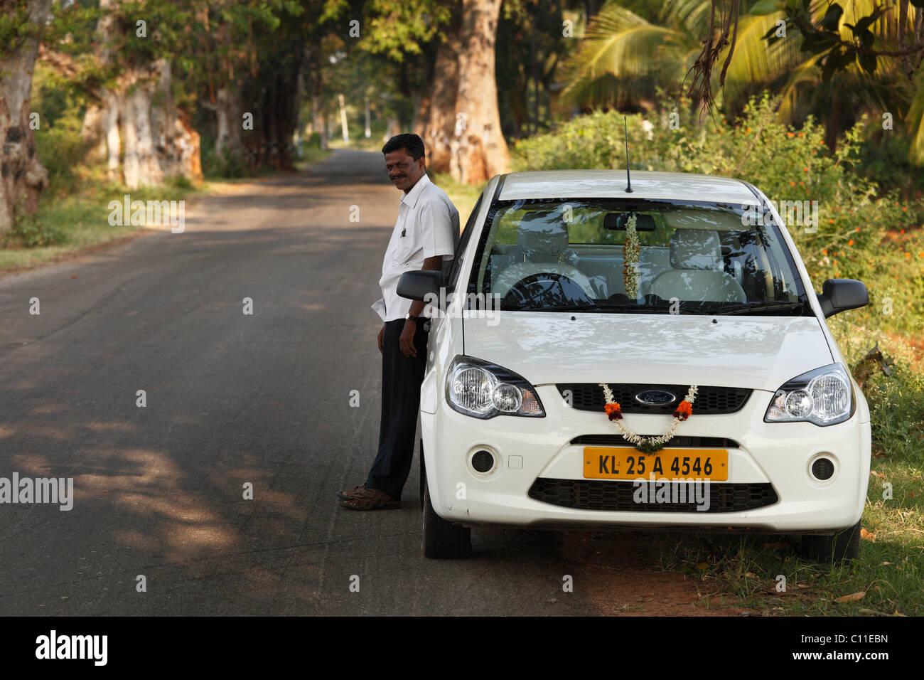 The driver Mr. Manikandan with Ford Escort, Courtallam, Western Ghats, Tamil Nadu, Tamilnadu, South India, India, Asia Stock Photo