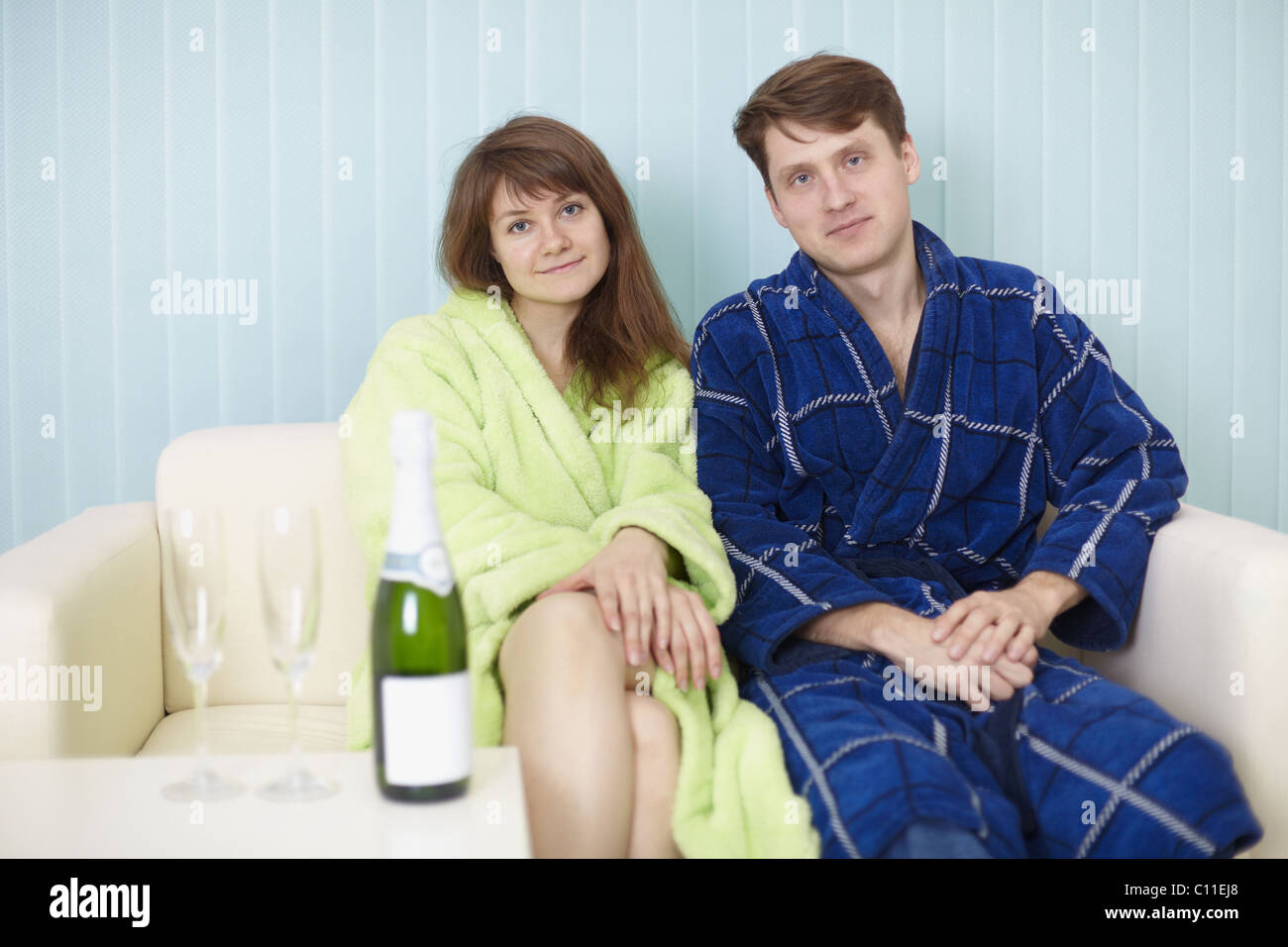 Young happy couple in dressing gowns Stock Photo