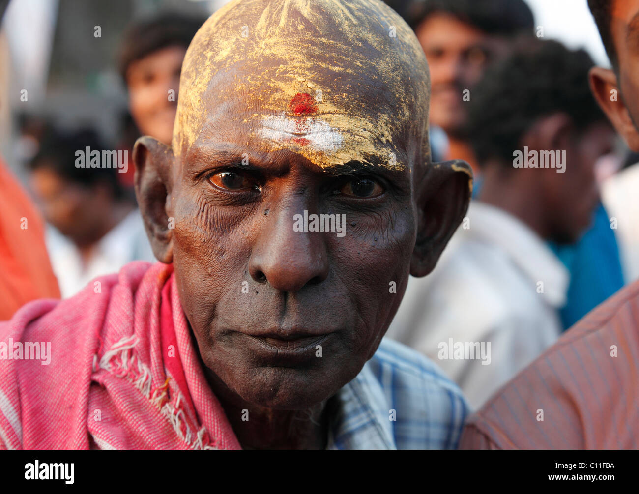 Hindu pilgrim with painted bald head, Thaipusam Festival in Palani, Tamil Nadu, Tamilnadu, South India, India, Asia Stock Photo