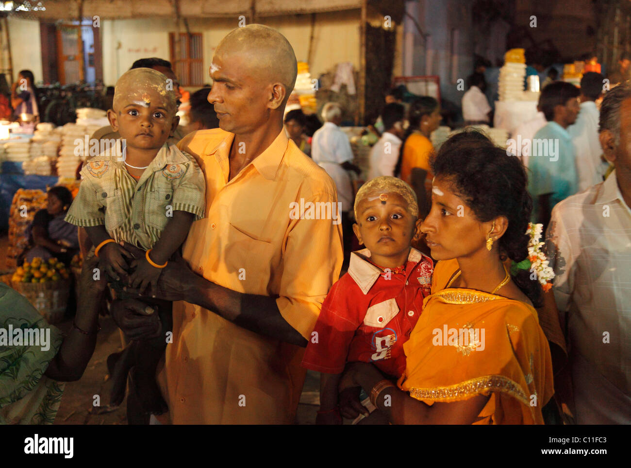 Parents and two boys with painted bald heads, Hindu pilgrims, Thaipusam Festival in , Tamilnadu, South India, India, Asia Stock Photo