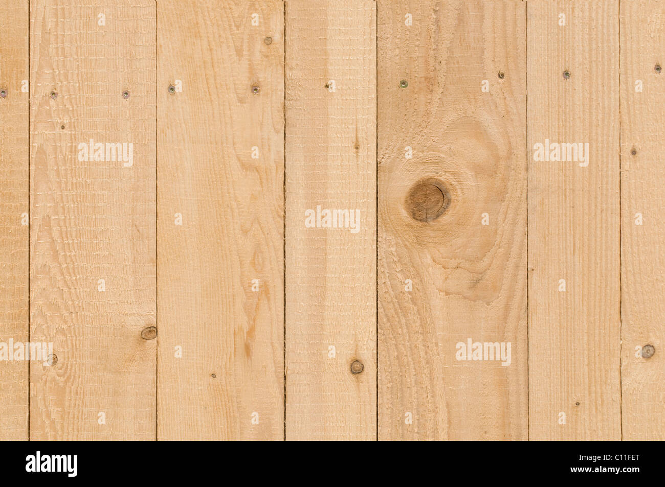 Detail, new plywood wall with screws, rough surface from the plane impact, background Stock Photo