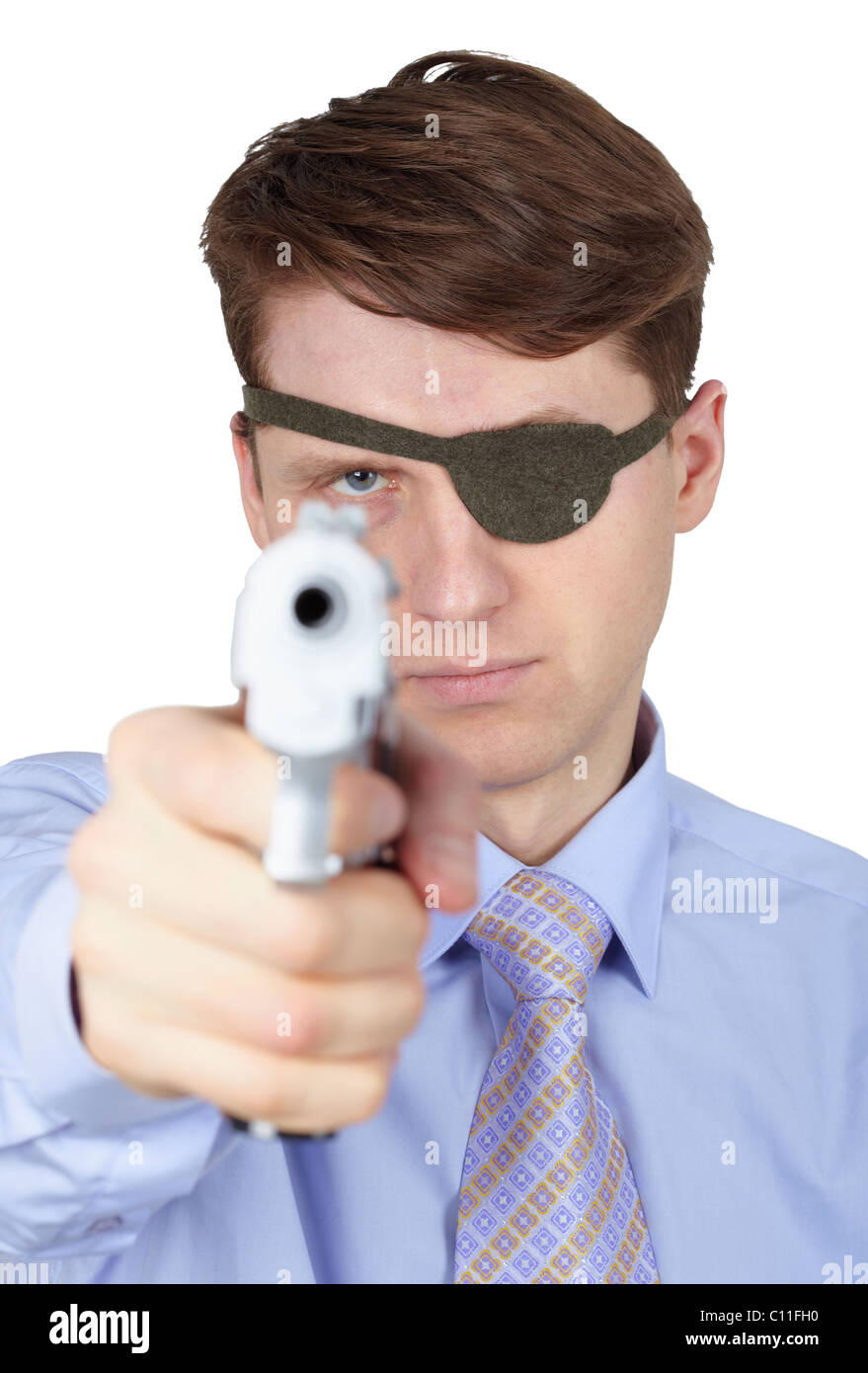 Portrait of young guy with eye-patch shooting a pistol Stock Photo