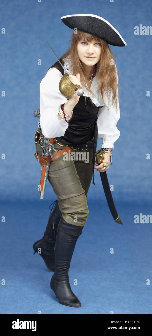 Aggressive woman in pirate costume on blue background Stock Photo