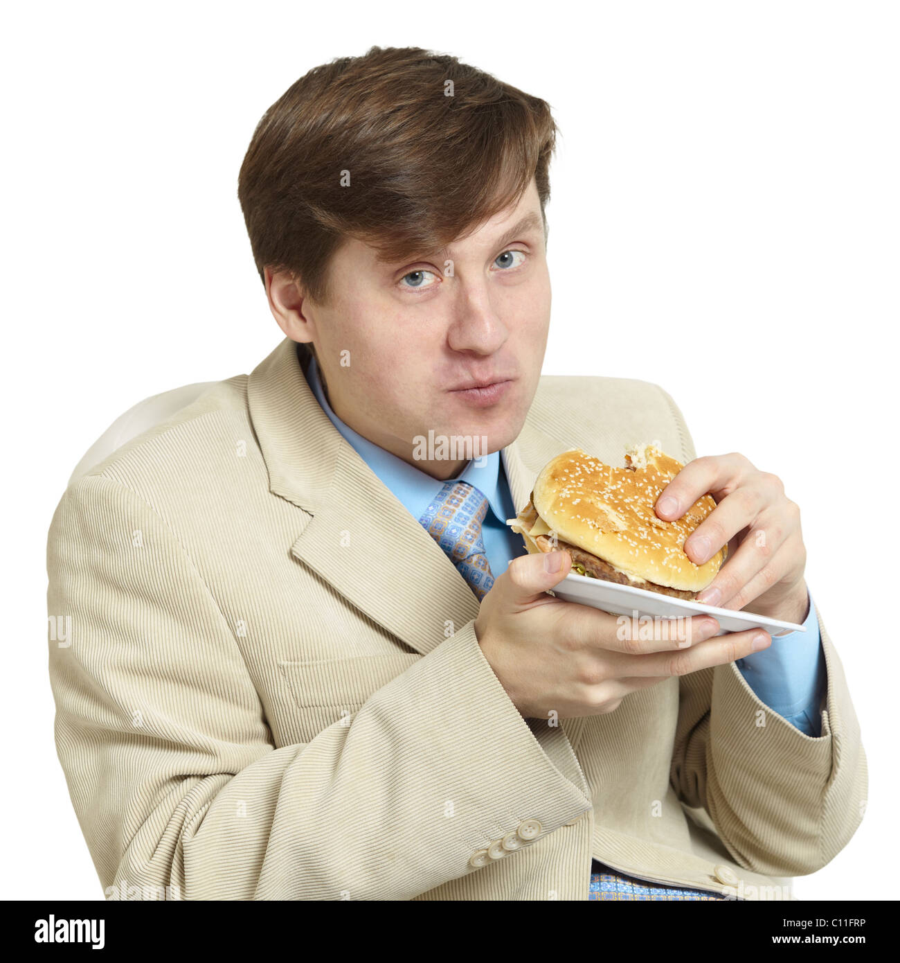 Funny businessman eats a sandwich isolated on a white Stock Photo