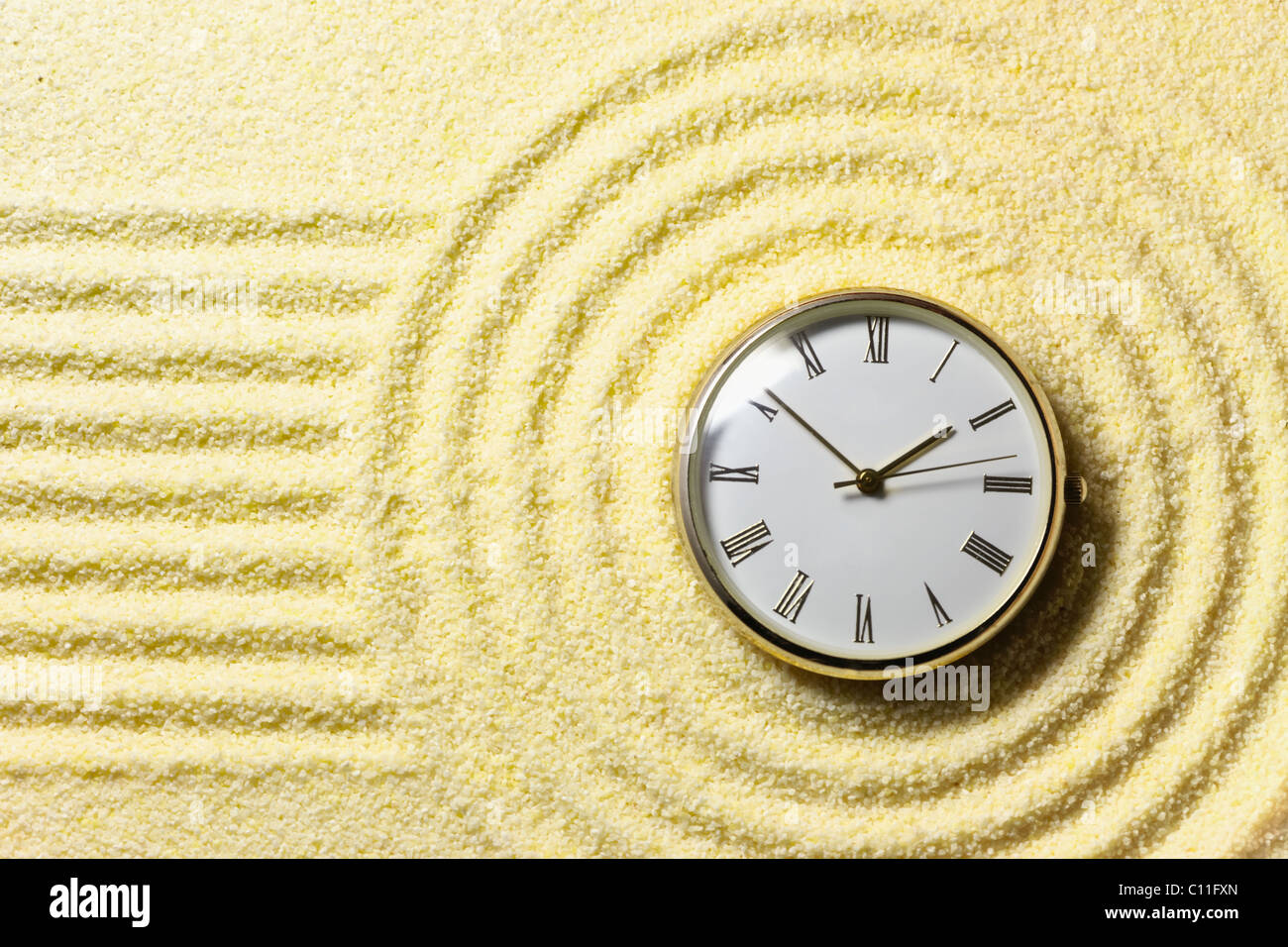 Composition on Zen garden - sand, and watch Stock Photo