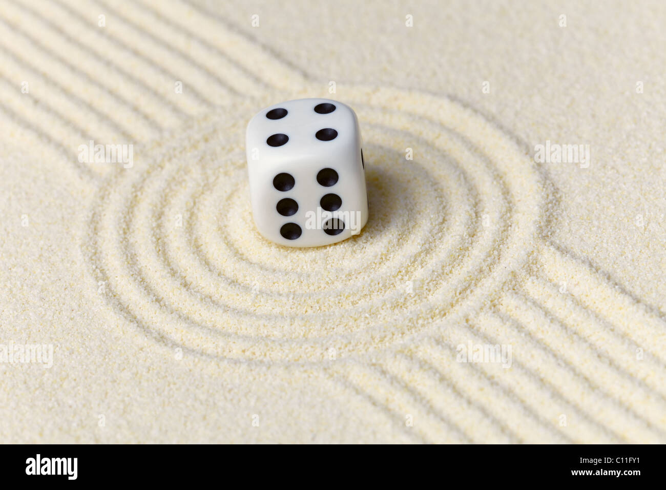 Composition on Zen garden - sand, and dice Stock Photo