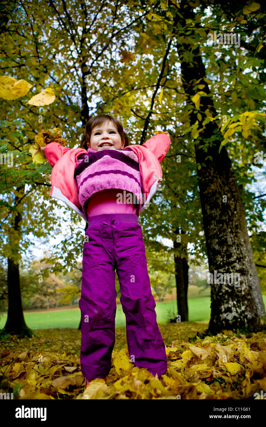 little girl in the autumn park Stock Photo - Alamy