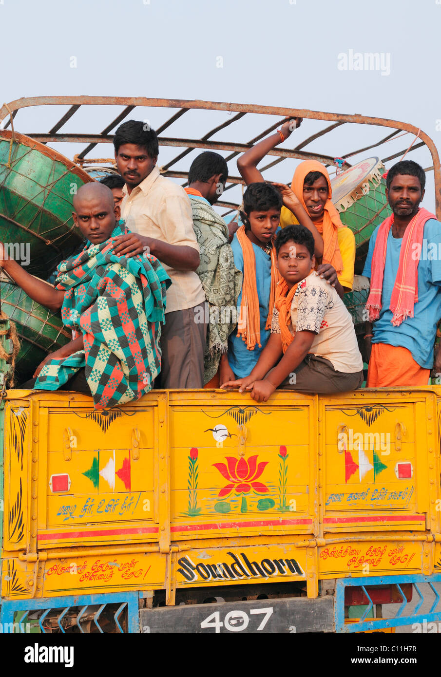 Hindu pilgrims with drums in a pickup truck on the way back from the Thaipusam Festival in Palani, , Tamilnadu, South India Stock Photo