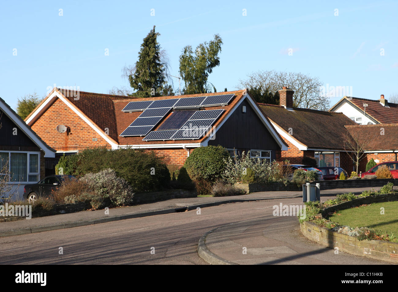 Solar panels on a house roof in the uk hires stock photography and