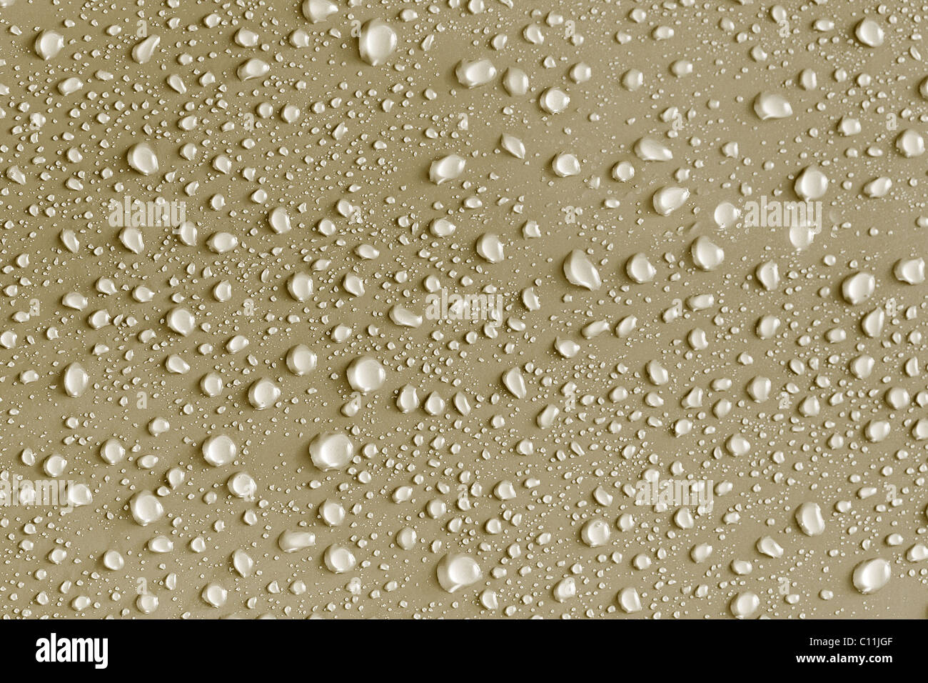 Water drops background on a gold surface Stock Photo