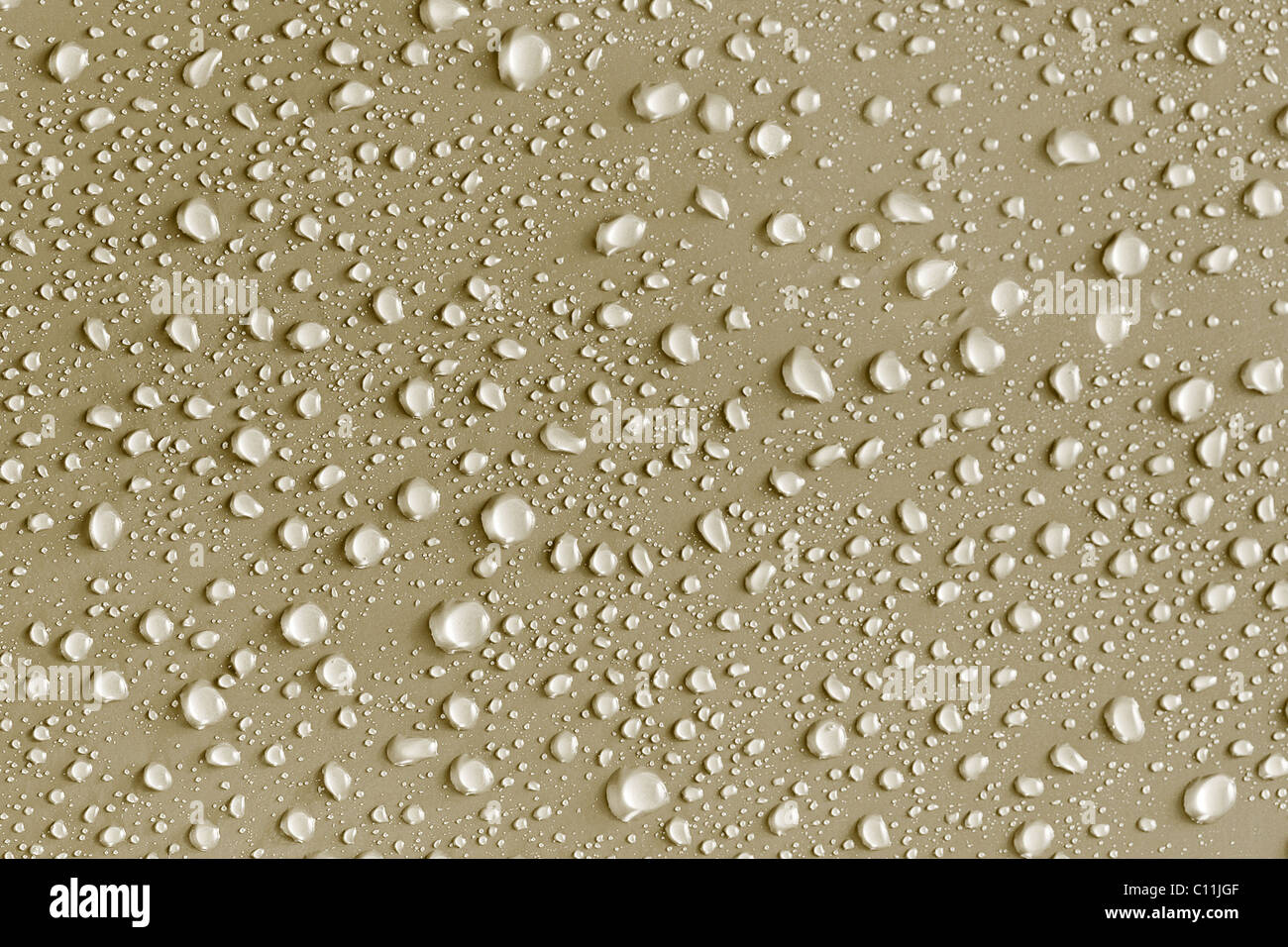 Water drops background on a gold surface Stock Photo - Alamy